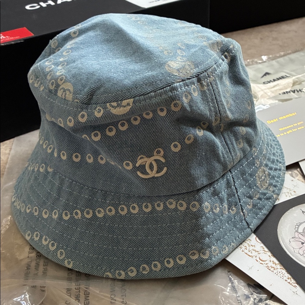 New in Box CHANEL Light Blue Denim Bucket Hat with White Pattern